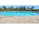 Community pool with plenty of lounge chairs at 25281 E Lenox Cir, Punta Gorda, FL 33950