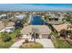 Aerial view of waterfront home with landscaped yard and community at 2748 Saint Thomas Dr, Punta Gorda, FL 33950