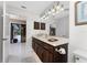 Guest bathroom with marble vanity and updated fixtures at 2748 Saint Thomas Dr, Punta Gorda, FL 33950