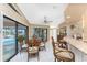 Kitchen nook with wooden table and chairs, overlooking the pool at 2748 Saint Thomas Dr, Punta Gorda, FL 33950