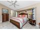 Large bedroom with king bed, dresser, and ceiling fan at 2748 Saint Thomas Dr, Punta Gorda, FL 33950