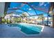 Inviting pool area with screened enclosure, offering water views at 2748 Saint Thomas Dr, Punta Gorda, FL 33950