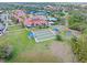 Aerial shot of the community with pools, bocce courts and lush landscaping at 2860 Arugula Dr, North Port, FL 34289