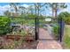 Fenced community garden with raised beds and flourishing plants at 2860 Arugula Dr, North Port, FL 34289