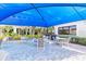 Charming outdoor patio with shaded seating areas, perfect for dining and entertaining in a serene setting at 2860 Arugula Dr, North Port, FL 34289