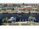 Aerial view of canal-front home with private boat dock and spacious backyard at 2871 Coral Way, Punta Gorda, FL 33950