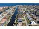 An aerial view showcasing the property's canal-front location and pool at 2871 Coral Way, Punta Gorda, FL 33950