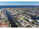 Wide aerial view of waterfront home in a residential neighborhood at 2871 Coral Way, Punta Gorda, FL 33950