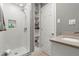 Updated bathroom with walk-in shower, built-in shelving, and modern vanity at 2871 Coral Way, Punta Gorda, FL 33950