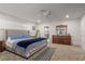 Large bedroom with king bed, wood dresser and carpet at 2871 Coral Way, Punta Gorda, FL 33950