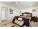 Bright bedroom with king-size bed and ensuite bathroom access at 2871 Coral Way, Punta Gorda, FL 33950