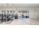 Bright dining area with sliding doors opening to a patio and water view at 2871 Coral Way, Punta Gorda, FL 33950