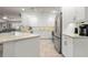 Updated kitchen featuring stainless steel appliances and white cabinetry at 2871 Coral Way, Punta Gorda, FL 33950