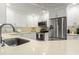 Modern kitchen with stainless steel appliances and white cabinetry at 2871 Coral Way, Punta Gorda, FL 33950