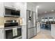 Modern kitchen with stainless steel appliances and white cabinets at 2871 Coral Way, Punta Gorda, FL 33950