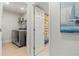 Convenient laundry room with washer, dryer, and additional storage at 2871 Coral Way, Punta Gorda, FL 33950