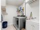 Laundry room with washer, dryer, and utility sink at 2871 Coral Way, Punta Gorda, FL 33950