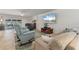 Bright living room featuring comfortable seating, large TV, and tile flooring at 2871 Coral Way, Punta Gorda, FL 33950