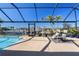 Relaxing poolside seating with canal views at 2871 Coral Way, Punta Gorda, FL 33950