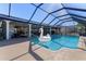 Inviting pool with a swan float and canal views at 2871 Coral Way, Punta Gorda, FL 33950