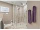 Walk-in shower with glass enclosure and tile surround at 2871 Coral Way, Punta Gorda, FL 33950