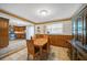 Dining area with wood table and chairs, adjacent to kitchen at 3360 Conway Blvd, Port Charlotte, FL 33952