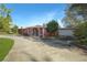 Pink single story home with attached garage and gated entrance at 3360 Conway Blvd, Port Charlotte, FL 33952