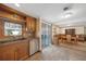 Kitchen with wood cabinets, stainless steel appliances, and view to dining area at 3360 Conway Blvd, Port Charlotte, FL 33952