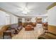 Spacious living room with tile floors and open floor plan at 3360 Conway Blvd, Port Charlotte, FL 33952