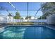 Relaxing swimming pool with screened enclosure and large backyard at 3360 Conway Blvd, Port Charlotte, FL 33952