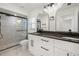 Modern bathroom with double vanity,dark countertops and walk-in shower at 3429 Sleepy Hollow Ln, Punta Gorda, FL 33950