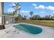 Inviting kidney-shaped pool with a spacious deck and lush landscaping at 3429 Sleepy Hollow Ln, Punta Gorda, FL 33950