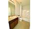 Clean bathroom with a vanity, toilet, and shower/tub at 3924 Candia Ave, North Port, FL 34286