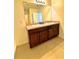 Double sink bathroom vanity with dark brown cabinets at 3924 Candia Ave, North Port, FL 34286