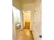 Hall bathroom with toilet and access to walk-in closet at 3924 Candia Ave, North Port, FL 34286