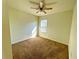 Bright bedroom featuring carpeted floors and a ceiling fan at 3924 Candia Ave, North Port, FL 34286