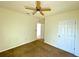 Sunny bedroom with carpeted floors and a ceiling fan at 3924 Candia Ave, North Port, FL 34286