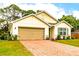 Newly built home with a large tan garage door at 3924 Candia Ave, North Port, FL 34286