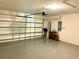 Garage with automatic opener, water heater, and storage cabinets at 3924 Candia Ave, North Port, FL 34286