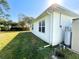 House exterior showcasing a well-maintained yard and a white exterior at 3924 Candia Ave, North Port, FL 34286