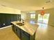 Open concept kitchen with island and view to Gathering room at 3924 Candia Ave, North Port, FL 34286