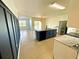 Modern kitchen with island, stainless steel appliances, and marble countertops at 3924 Candia Ave, North Port, FL 34286