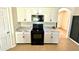 Kitchen boasting black appliances and marble countertops at 3924 Candia Ave, North Port, FL 34286