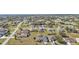 Aerial view of homes, landscape, and roads in a community at 413 San Ambrosio St, Punta Gorda, FL 33983