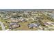 Aerial view showing neighborhood with houses and green spaces at 413 San Ambrosio St, Punta Gorda, FL 33983