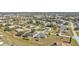 Aerial view of a residential neighborhood showcasing homes with pools and lush landscaping at 413 San Ambrosio St, Punta Gorda, FL 33983