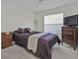 Bedroom with queen bed and dresser at 413 San Ambrosio St, Punta Gorda, FL 33983