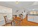 Cozy dining area with glass table and wood chairs near kitchen at 413 San Ambrosio St, Punta Gorda, FL 33983