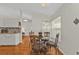 A well lit dining area with a round glass table and four chairs at 413 San Ambrosio St, Punta Gorda, FL 33983