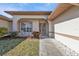 Front entry with walkway and manicured landscaping at 413 San Ambrosio St, Punta Gorda, FL 33983